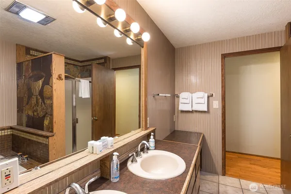 a bathroom with a sink and a mirror