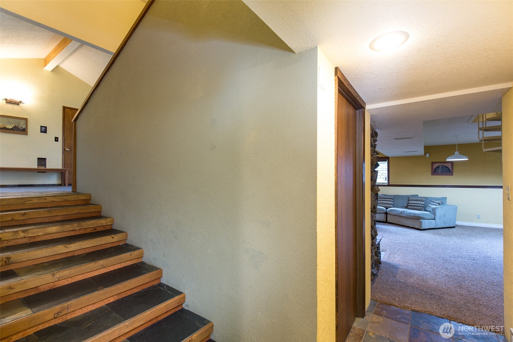 3547 Deer Park Road Port Angeles, WA 98362 - Photo 26 of 37 a view of a hallway with wooden floor and a bathroom