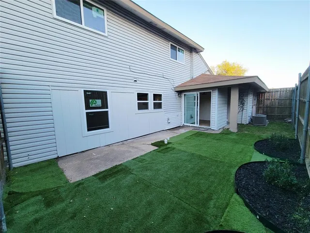 a view of a house with a yard and plants