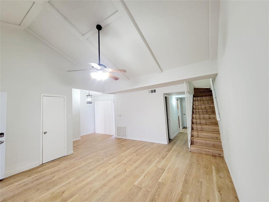 735 Arrowhead Circle Garland, TX 75043 - Photo 4 of 20 a view of a room with wooden floor ceiling fan and window