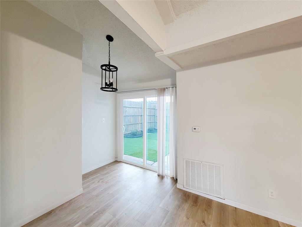 735 Arrowhead Circle Garland, TX 75043 - Photo 6 of 20 a view of empty room with wooden floor