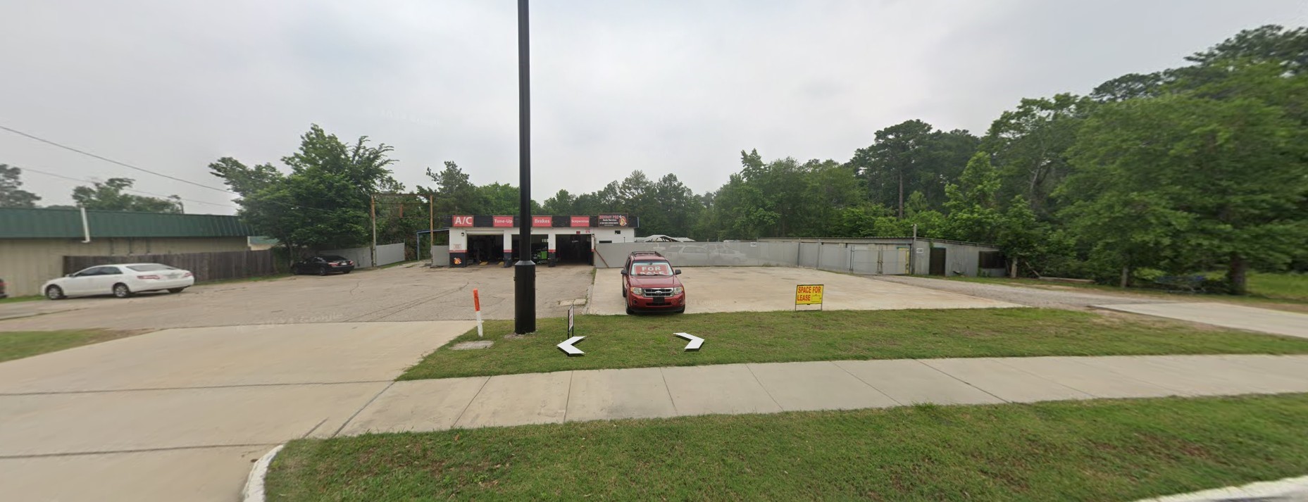 1100 Wilson Road Conroe, TX 77301 - Photo 3 of 5 a view of outdoor space with garden