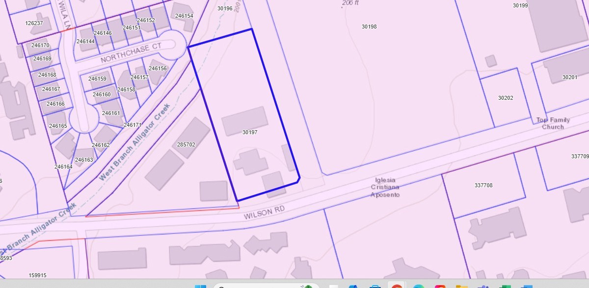 1100 Wilson Road Conroe, TX 77301 - Photo 5 of 5 a picture of a street