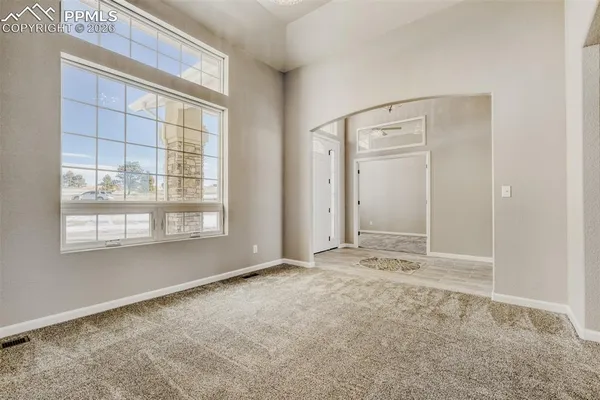 a view of a livingroom with furniture and window