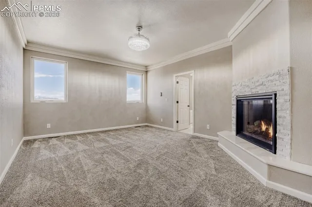 a spacious bathroom with a granite countertop sink a mirror and a shower