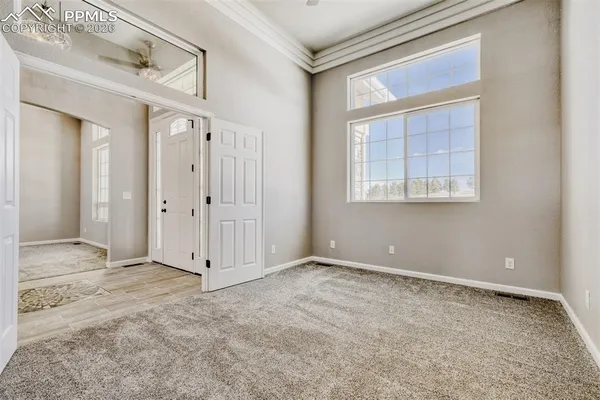 a bathroom with a granite countertop sink toilet a mirror a vanity and shower