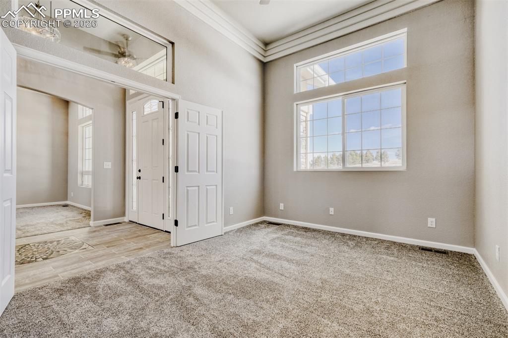 13680 Woodlake Road Elbert, CO 80106 - Photo 16 of 47 an empty room with windows