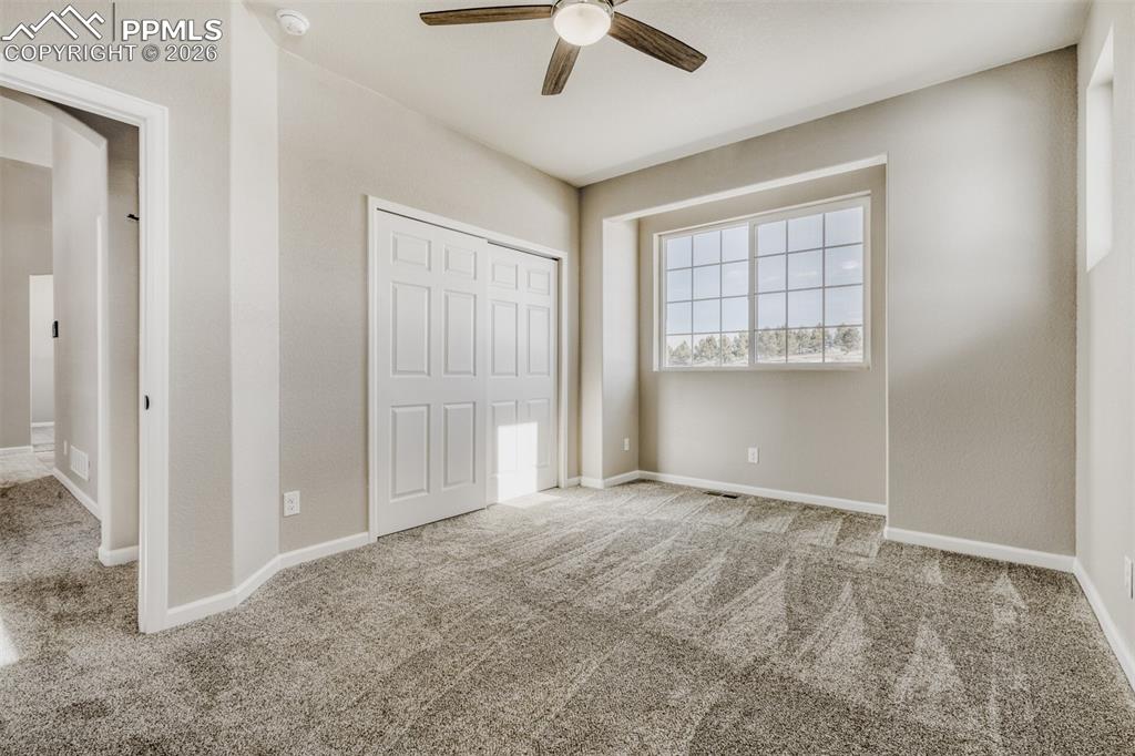 13680 Woodlake Road Elbert, CO 80106 - Photo 19 of 38 a view of an empty room with a window