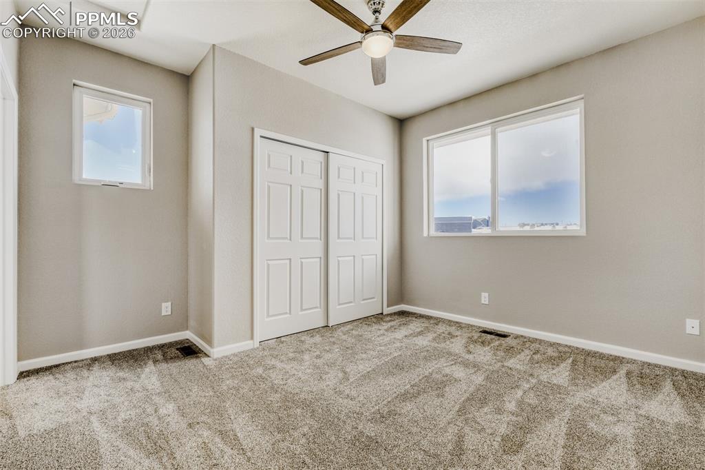 13680 Woodlake Road Elbert, CO 80106 - Photo 21 of 38 a view of an empty room with a window