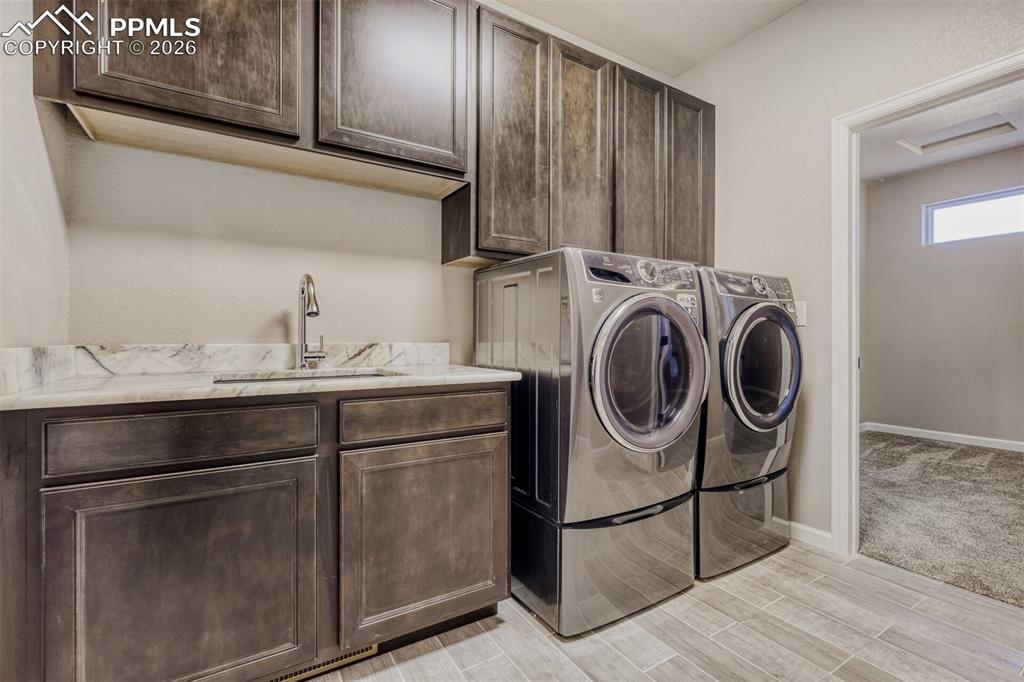 13680 Woodlake Road Elbert, CO 80106 - Photo 22 of 38 a utility room with dryer and washer
