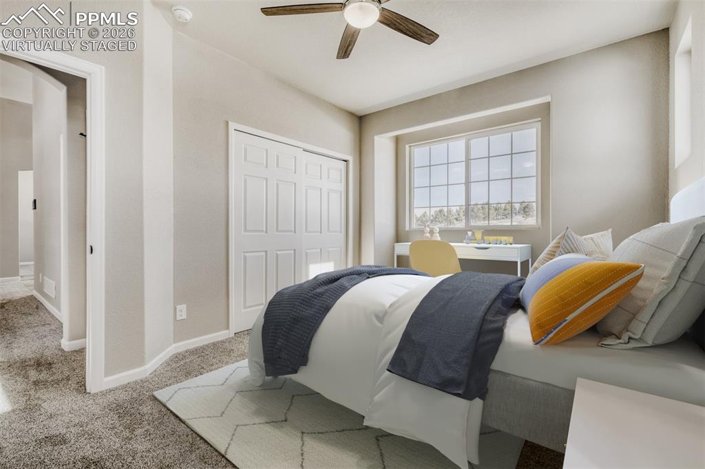 13680 Woodlake Road Elbert, CO 80106 - Photo 25 of 47 a bedroom with a bed and a window