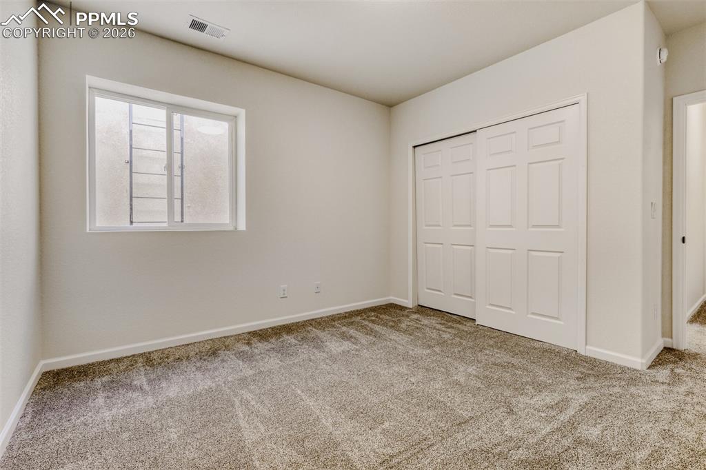 13680 Woodlake Road Elbert, CO 80106 - Photo 27 of 38 an empty room with windows