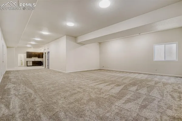 a kitchen with stainless steel appliances a stove a refrigerator and a sink