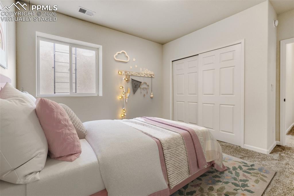 13680 Woodlake Road Elbert, CO 80106 - Photo 35 of 47 a bedroom with a bed and a window