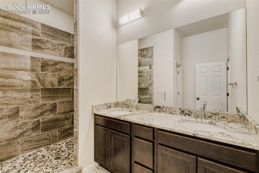 13680 Woodlake Road Elbert, CO 80106 - Photo 37 of 47 a bathroom with a sink and a mirror