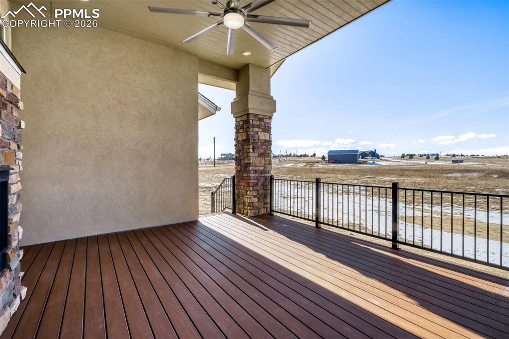 13680 Woodlake Road Elbert, CO 80106 - Photo 9 of 47 a view of a balcony with wooden floor