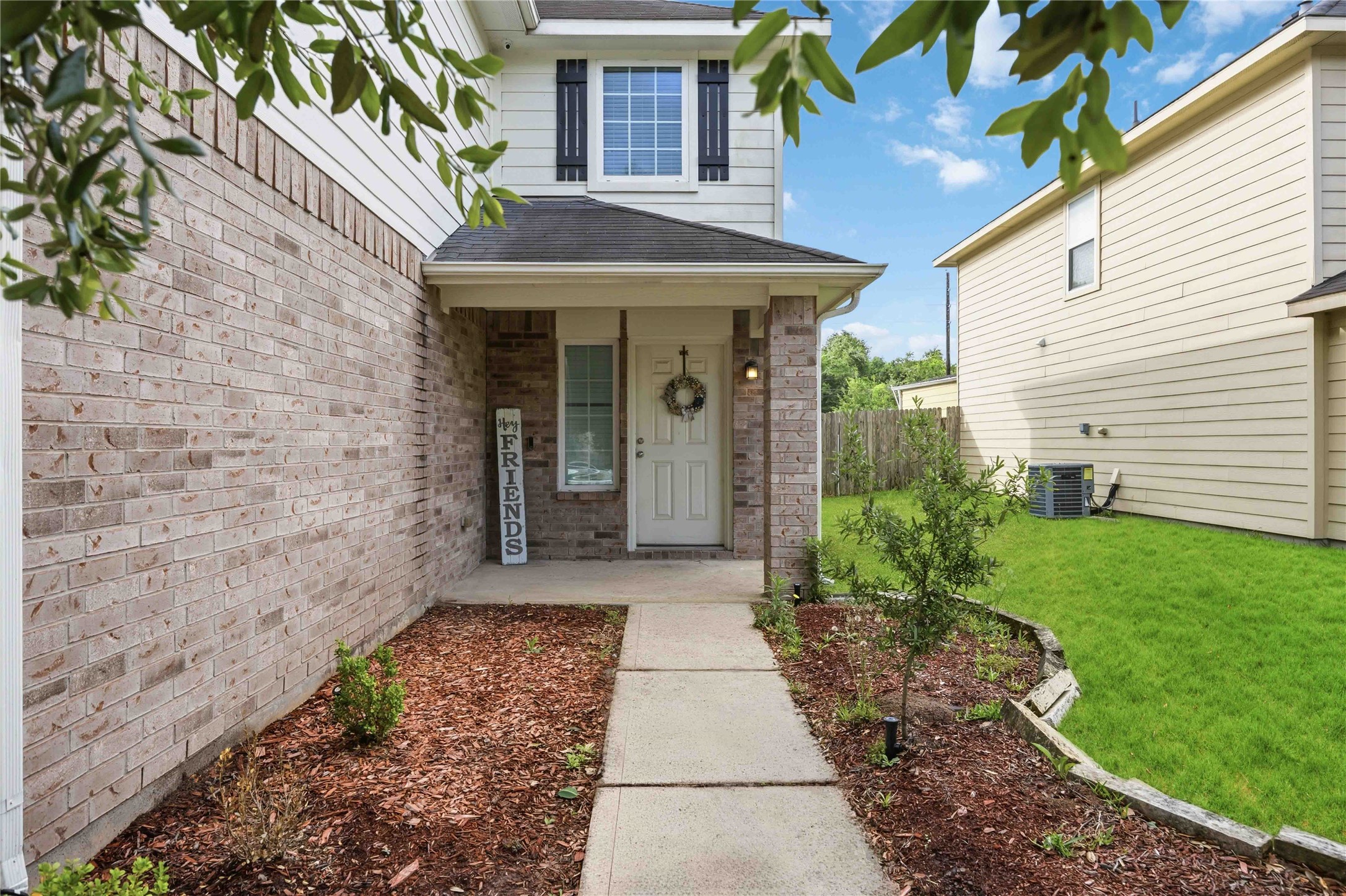 3538 Maris Way Humble, TX 77338 - Photo 3 of 24 Charming covered front entry featuring a brick façade, landscaped walkway, and inviting front door that create warm curb appeal and a welcoming first impression.