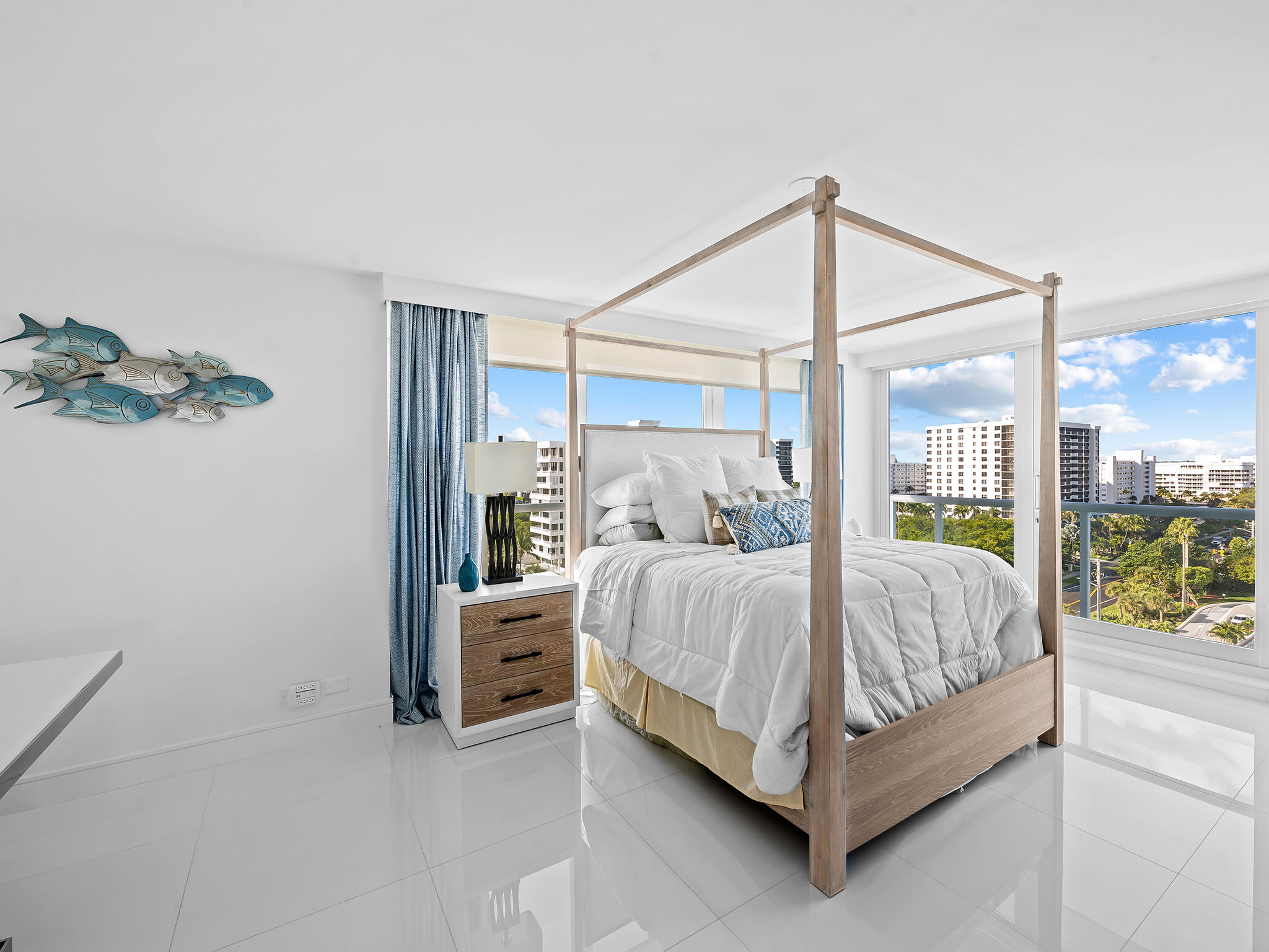 3505 South Ocean Boulevard, Unit 10N Highland Beach, FL 33487 - Photo 17 of 42 a bed sitting in a bedroom next to a window