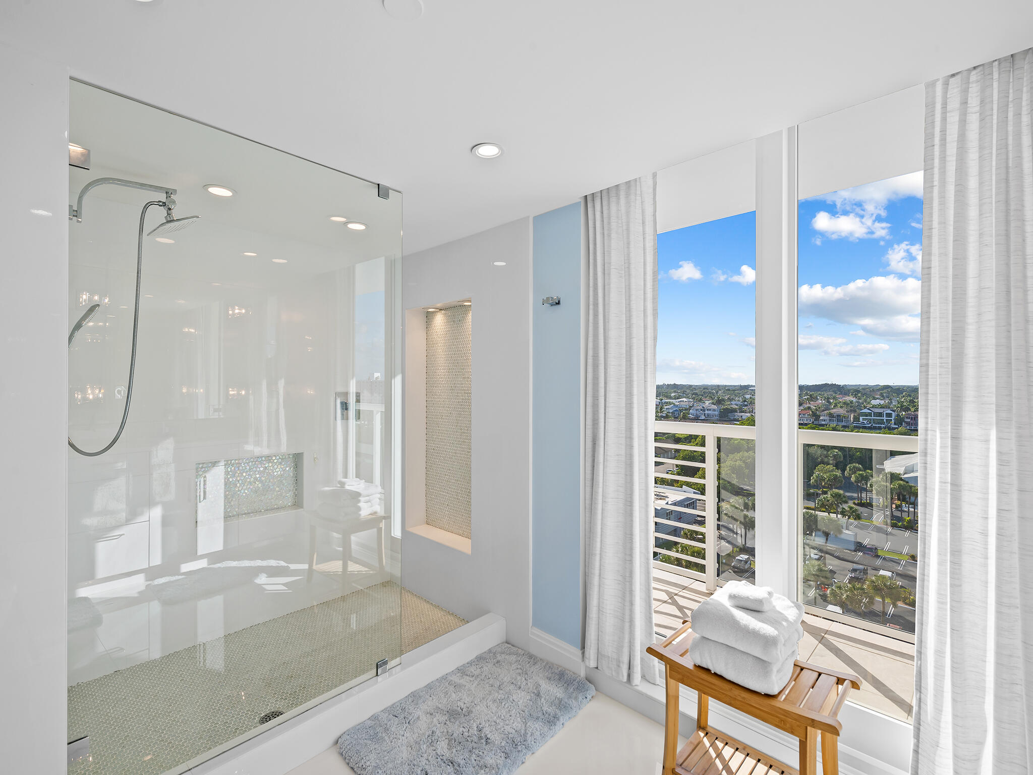 3505 South Ocean Boulevard, Unit 10N Highland Beach, FL 33487 - Photo 19 of 42 a bathroom with a glass shower door and a window