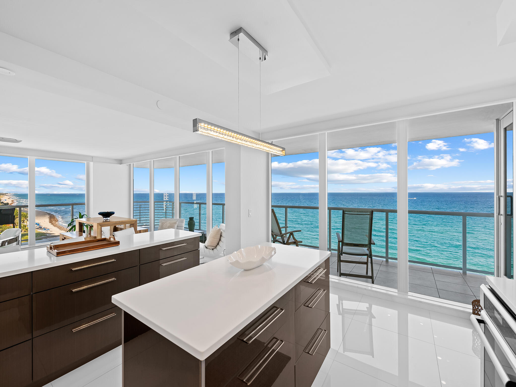 3505 South Ocean Boulevard, Unit 10N Highland Beach, FL 33487 - Photo 2 of 42 a kitchen with sink a large window and a counter top space