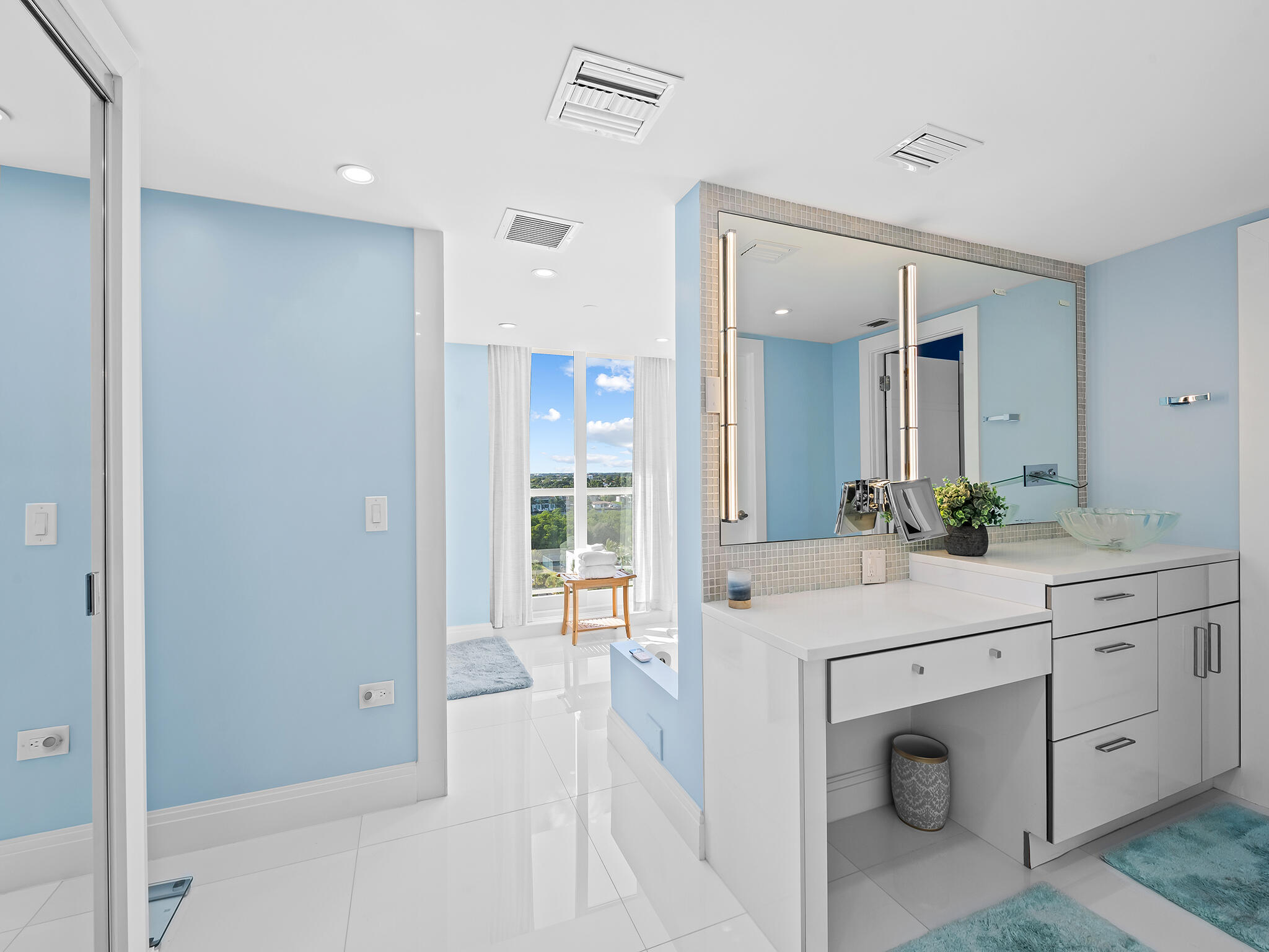 3505 South Ocean Boulevard, Unit 10N Highland Beach, FL 33487 - Photo 21 of 42 a spacious bathroom with a granite countertop sink a mirror and a shower