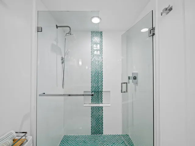 a living room with furniture large window and flat screen tv