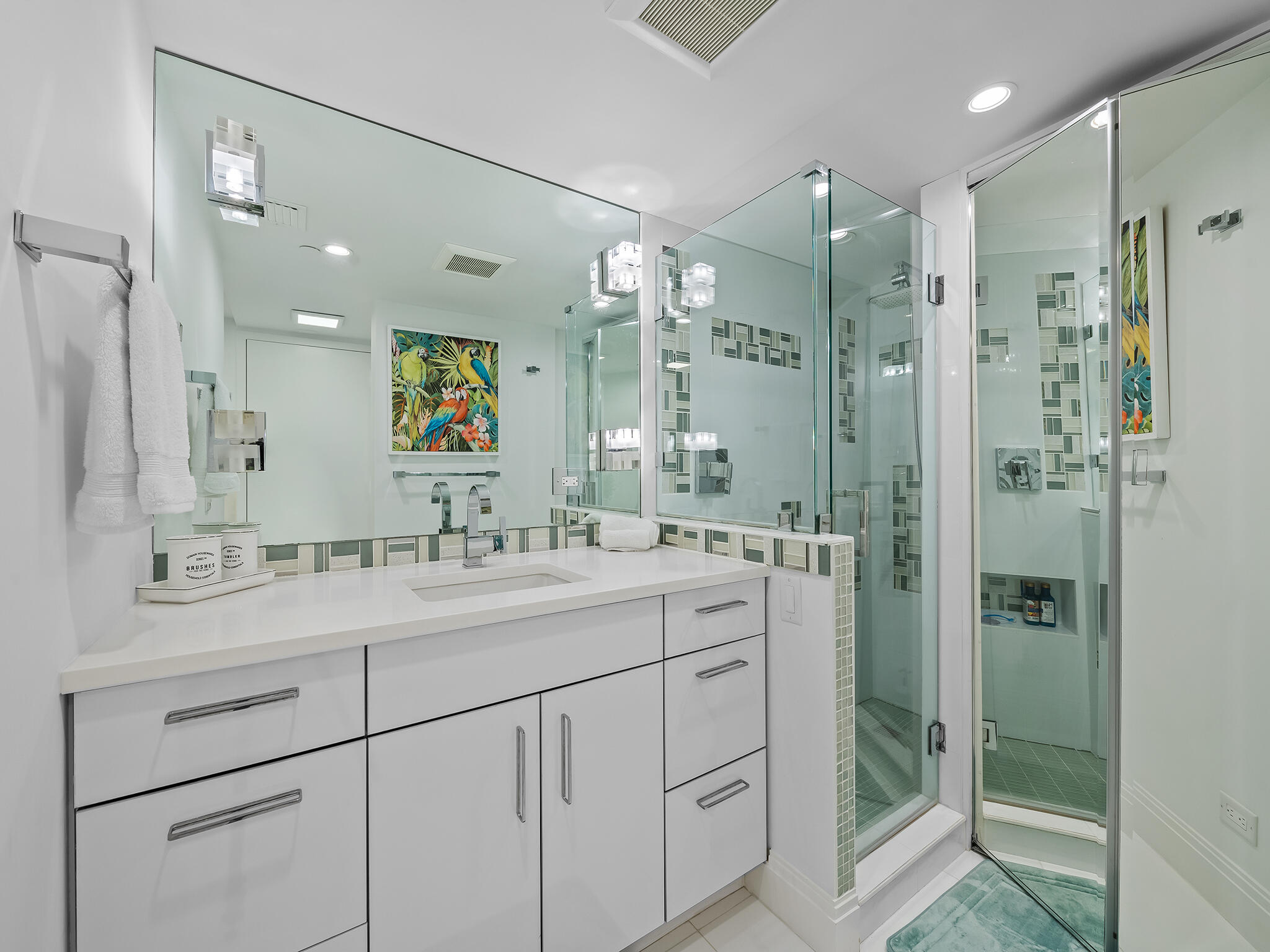3505 South Ocean Boulevard, Unit 10N Highland Beach, FL 33487 - Photo 32 of 42 a bathroom with a shower sink and mirror