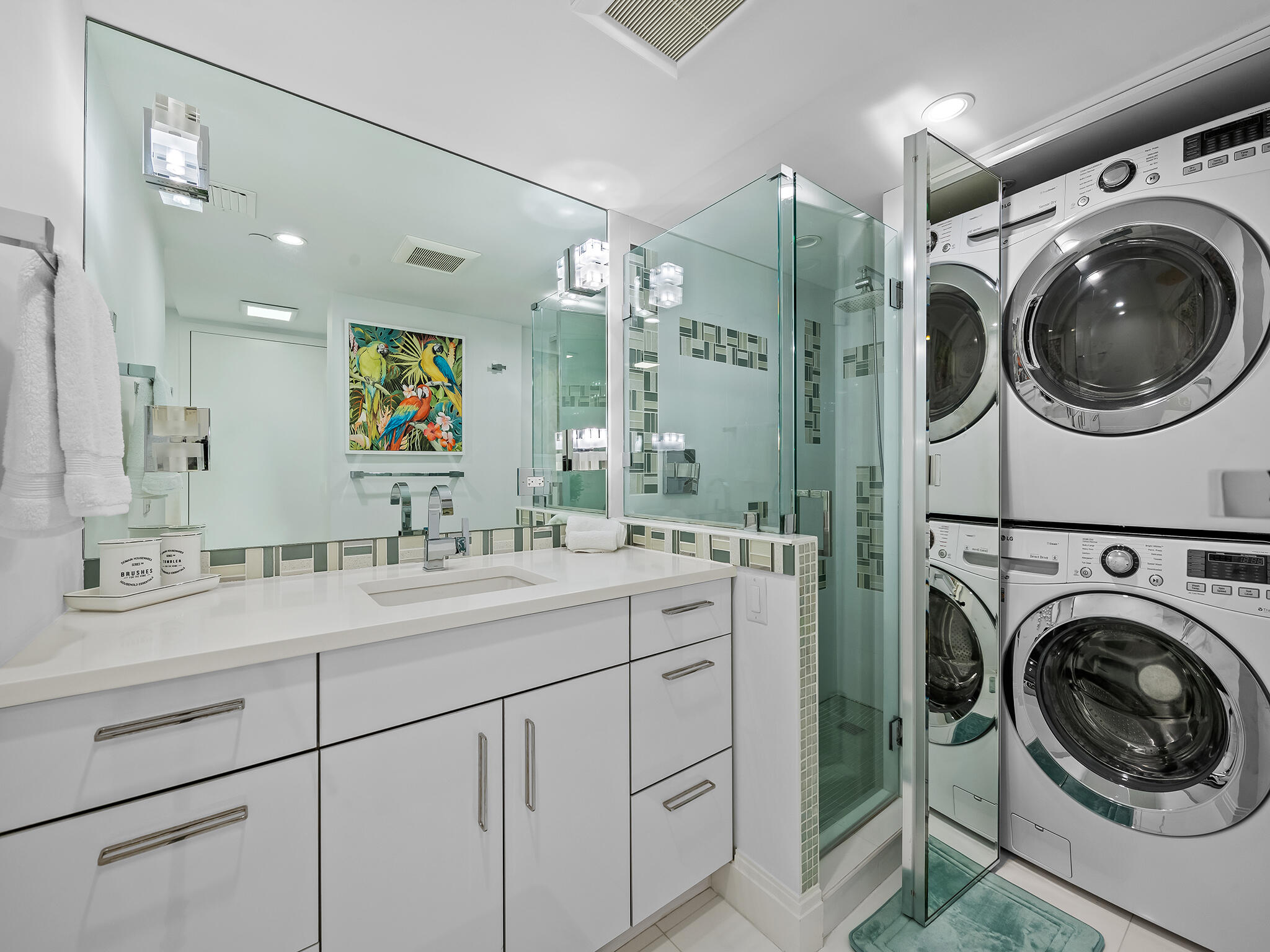 3505 South Ocean Boulevard, Unit 10N Highland Beach, FL 33487 - Photo 33 of 42 a en suite bathroom with a sink a washer and dryer