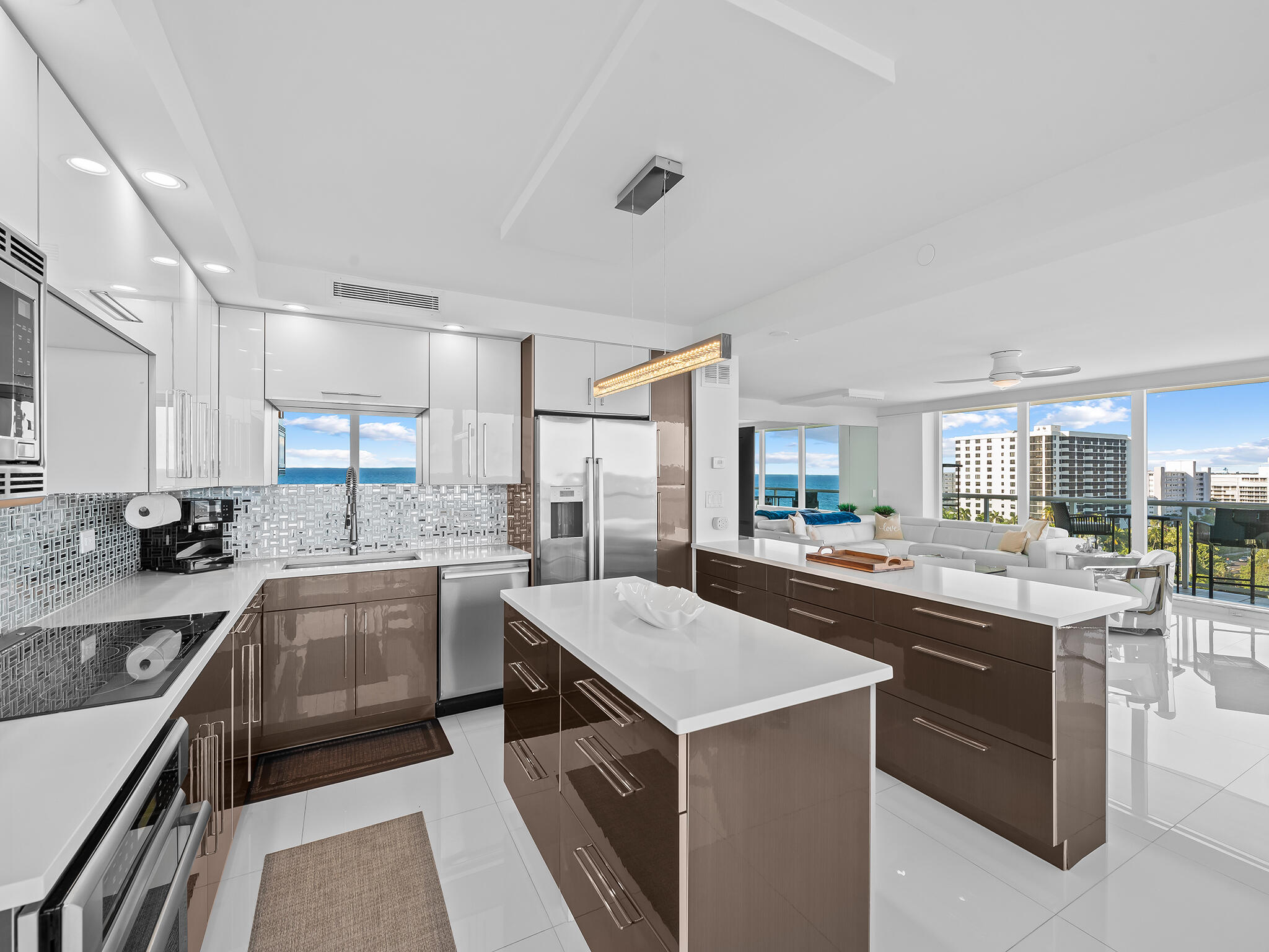 3505 South Ocean Boulevard, Unit 10N Highland Beach, FL 33487 - Photo 6 of 42 a kitchen with a sink stove and cabinets