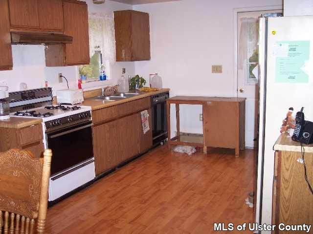 215 South Riverside Road Highland, NY 12528 - Photo 2 of 4 a kitchen with stainless steel appliances a stove a sink and a refrigerator