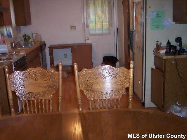 215 South Riverside Road Highland, NY 12528 - Photo 3 of 4 a view of a dining room with furniture and window