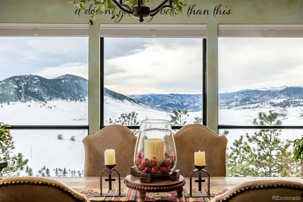 a view of a porch with furniture and a window