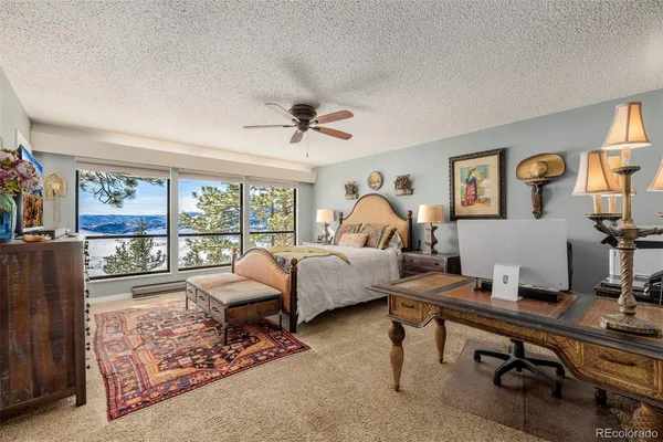 a bedroom with furniture and a window