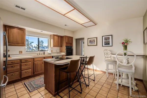 a view of a dining room with furniture and a window