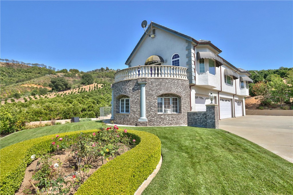46856 El Prado Road Temecula, CA 92590 - Photo 52 of 75 a front view of a house with a yard