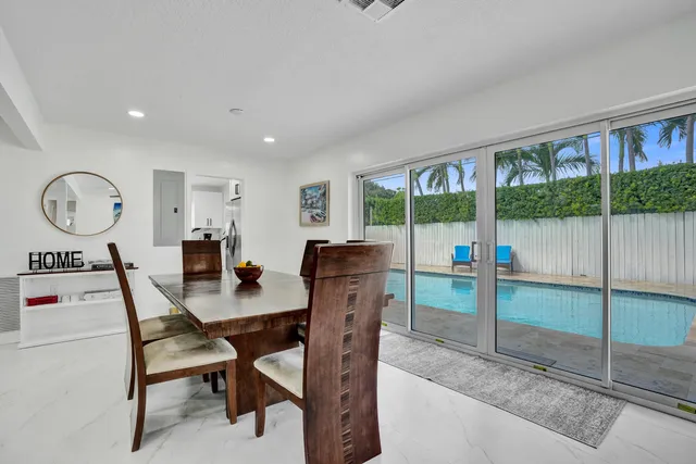 a view of a workspace with furniture and a backyard