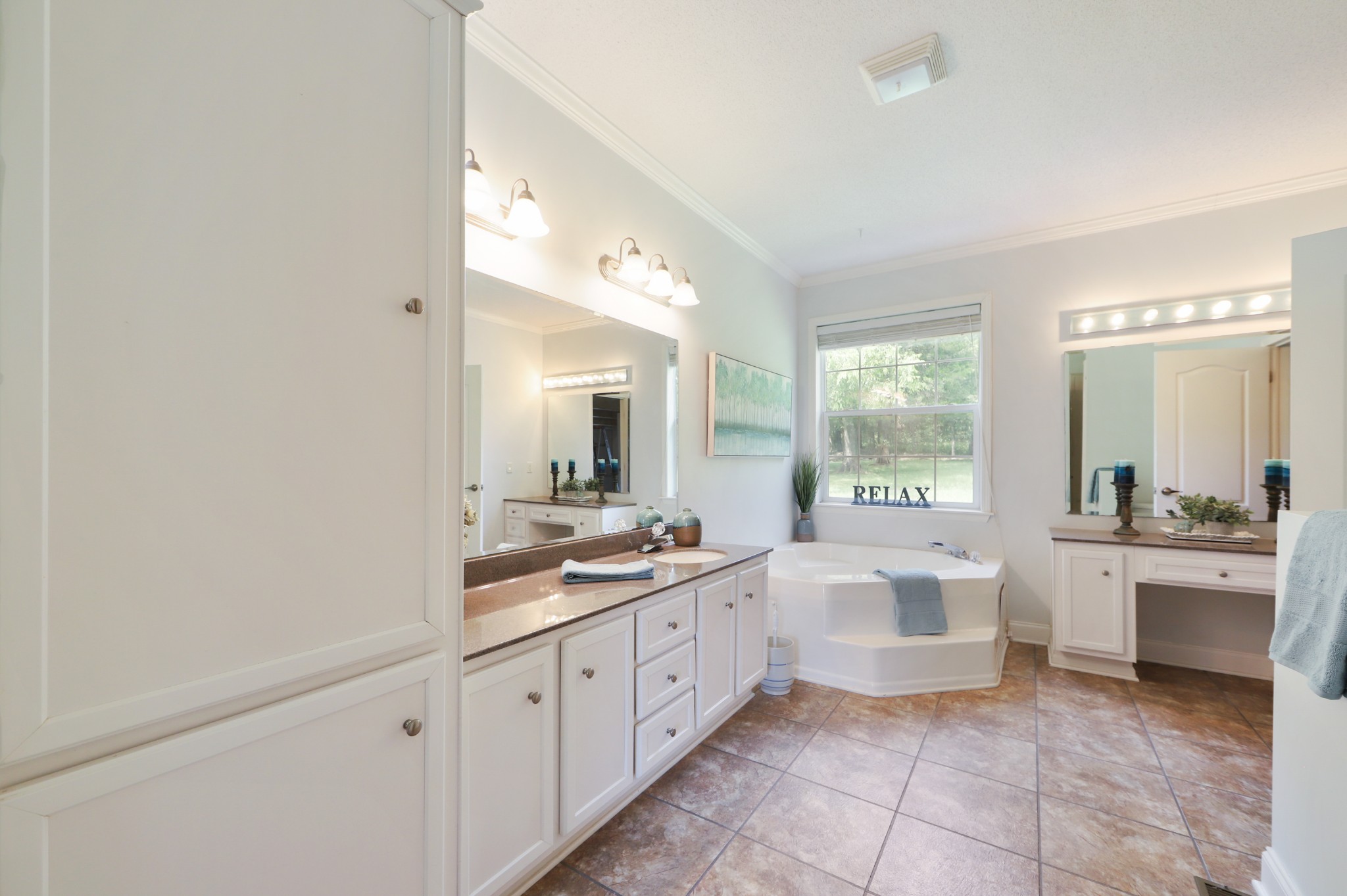 5721 B Hebron Road Lebanon, TN 37090 - Photo 22 of 34 a large bathroom with a double vanity sink and a large mirror