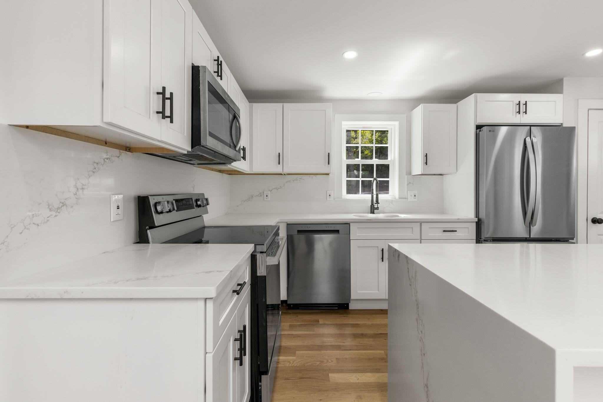 81 Sam Turner Road East Falmouth, MA 02536 - Photo 18 of 37 a kitchen with stainless steel appliances a sink stove and refrigerator
