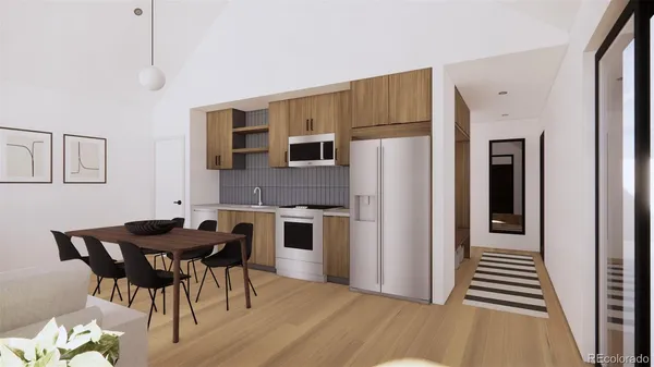 a kitchen with stainless steel appliances a refrigerator and a stove top oven