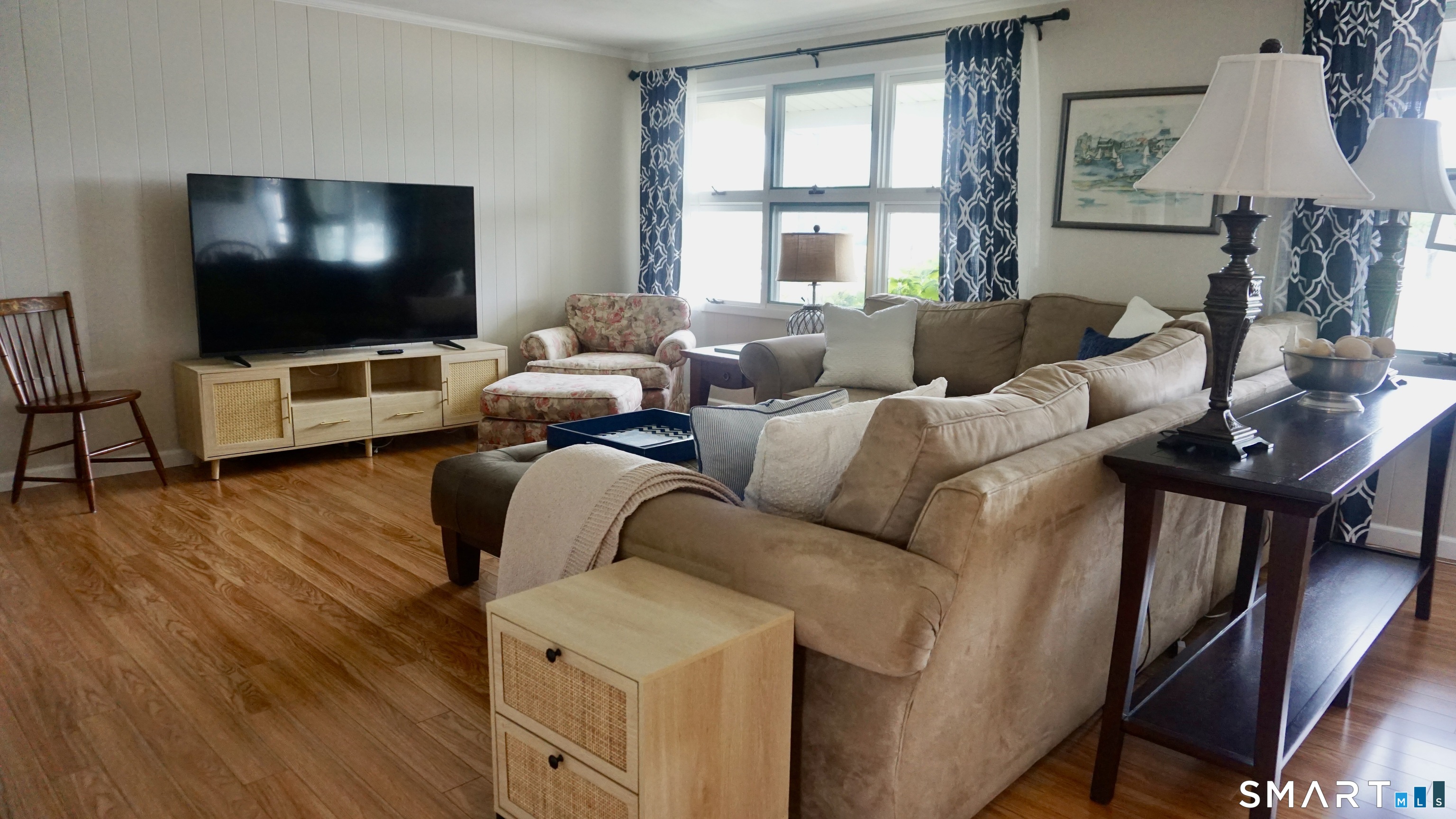 13 Pacific Street Groton, CT 06340 - Photo 11 of 31 a living room with furniture and a flat screen tv