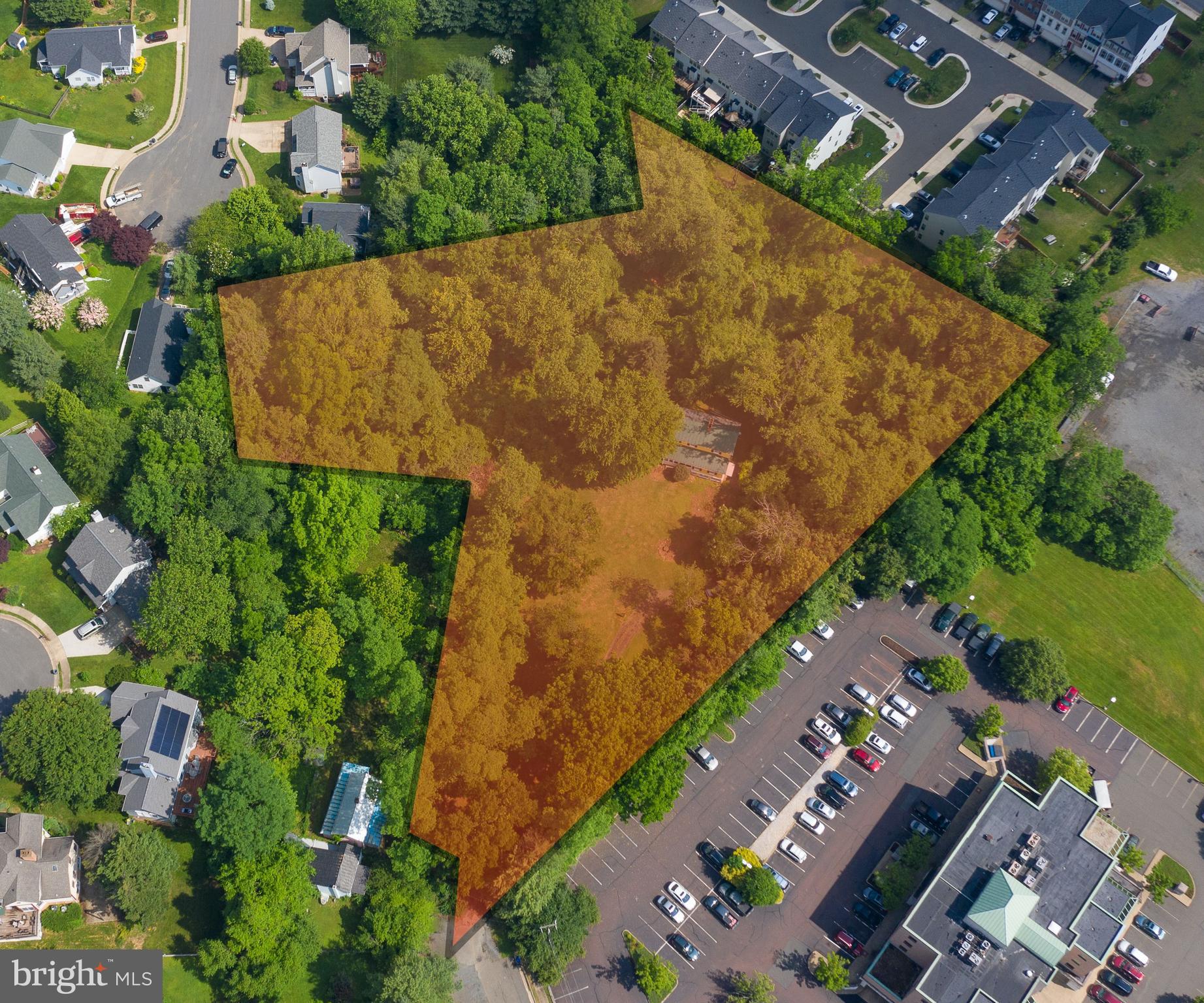 an aerial view of a residential houses with outdoor space