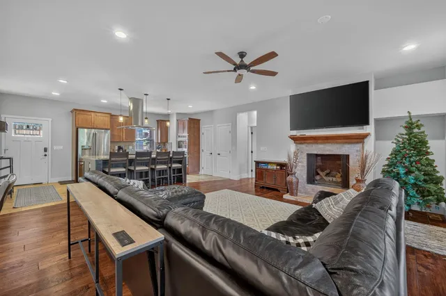 a bedroom with a bed and ceiling fan