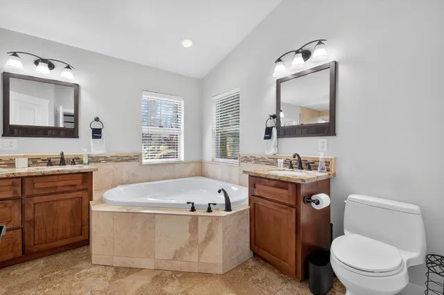 an aerial view of a house with outdoor space and street view