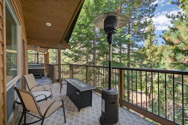 a view of a lush green forest with a lake and mountain view