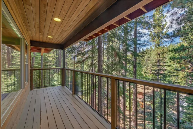 a kitchen with stainless steel appliances granite countertop a stove and a large refrigerator
