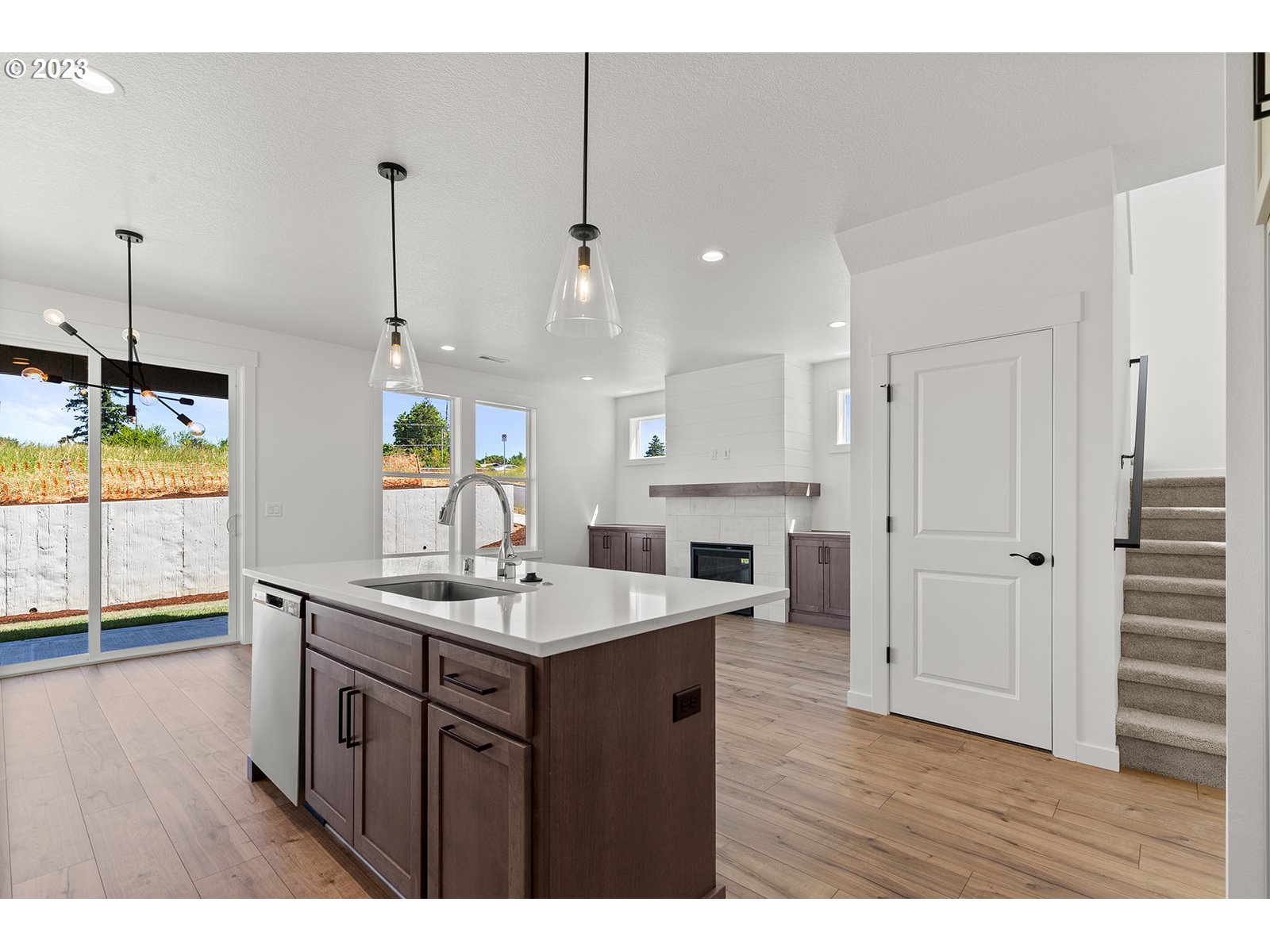 906 Northwest 178th Street Ridgefield, WA 98642 - Photo 13 of 28 a kitchen with a sink a counter top space and stainless steel appliances