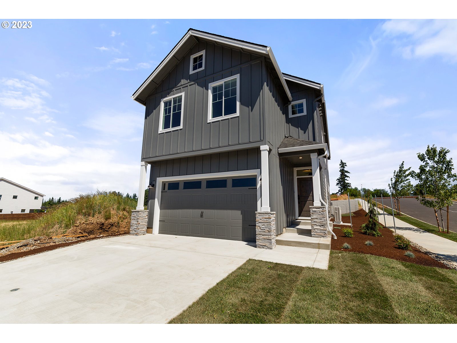 906 Northwest 178th Street Ridgefield, WA 98642 - Photo 3 of 28 a view of a house with a yard