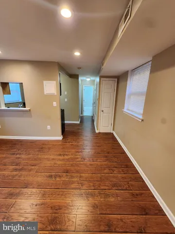 a view of a hallway with an empty room