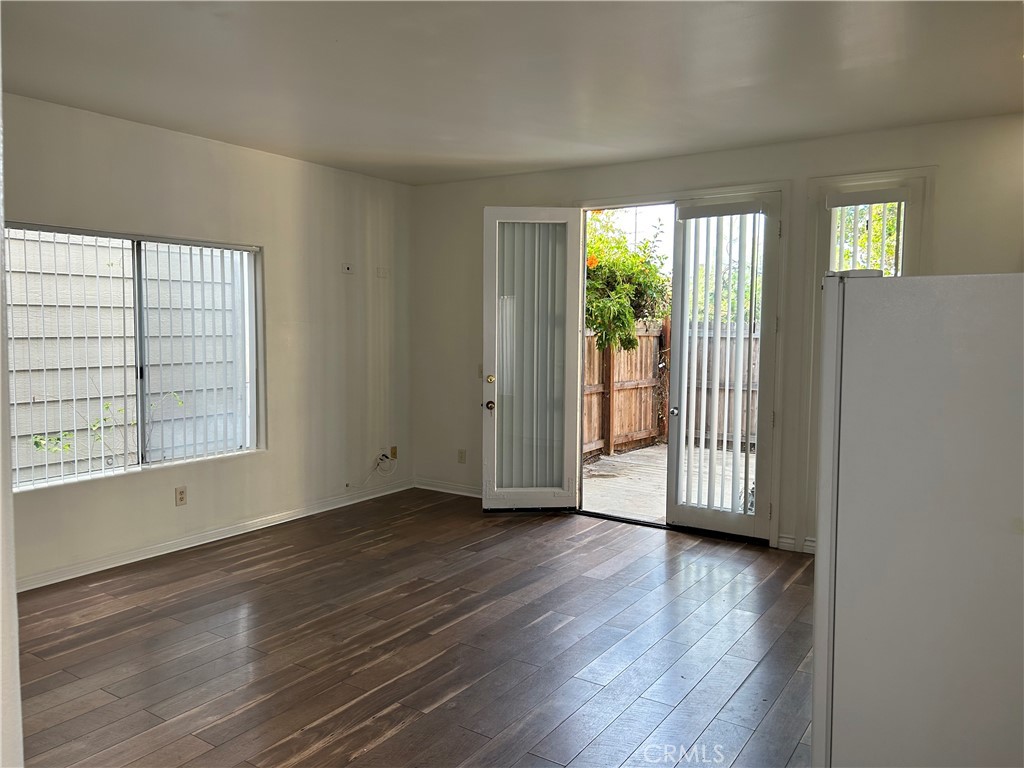 212 Rochester Avenue Huntington Beach, CA 92648 - Photo 3 of 10 Living space open to kitchenette and front fenced patio