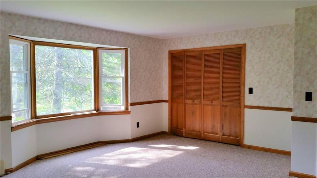 1082 Industry Road Industry, ME 04938 - Photo 10 of 19 Spacious master bedroom with sunny...